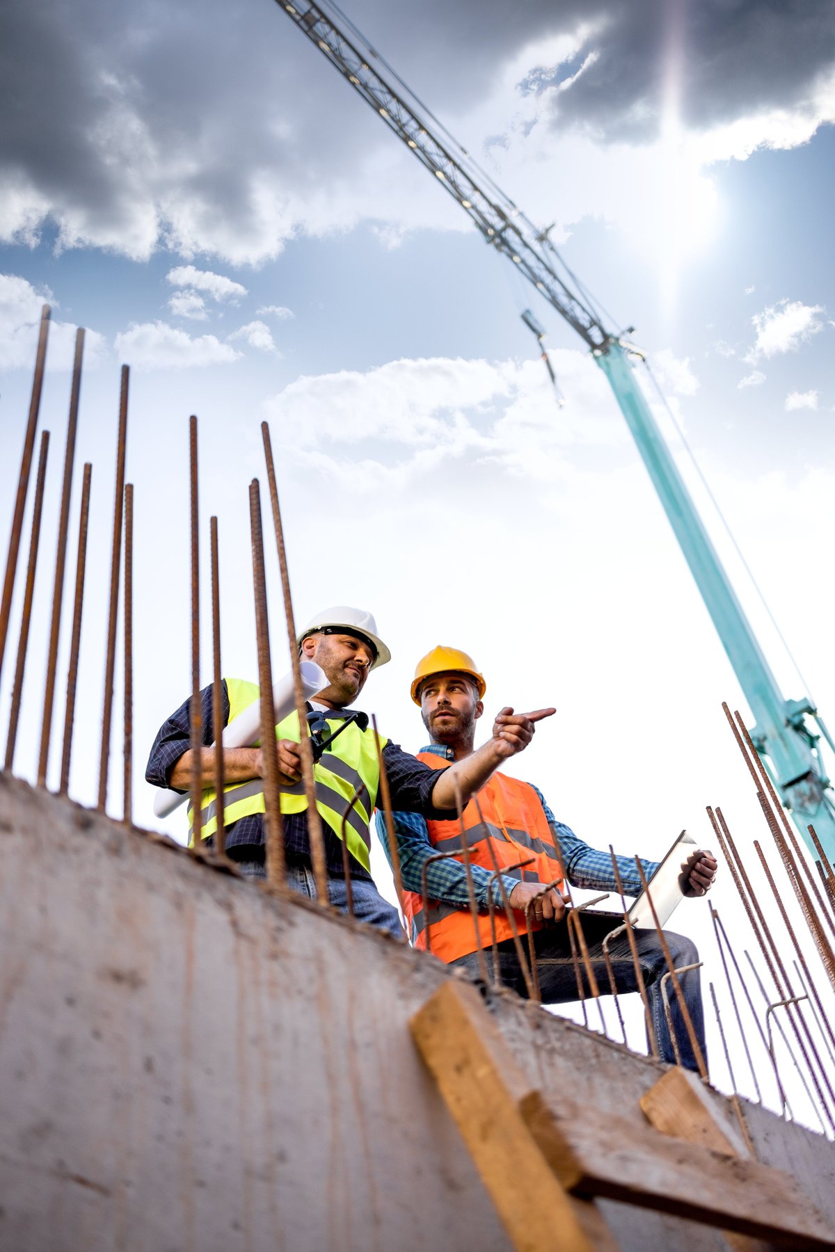 Construction professionals in hardhats on a building site